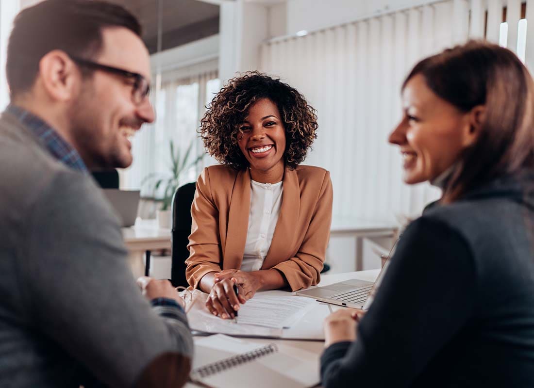 401(k) - Couple Meeting and Consulting with a Female Financial Advisor at the Her Office to Discuss Retirement Saving Options