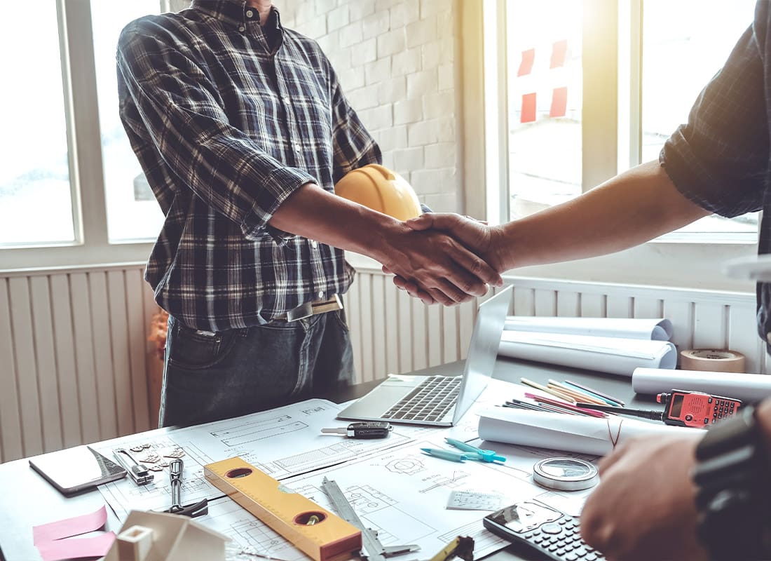 Insurance by Industry - Engineer and Contractor Shaking Hands Success of the Project Work Together